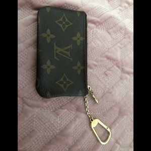Louis Vuitton monogrammed key pouch.